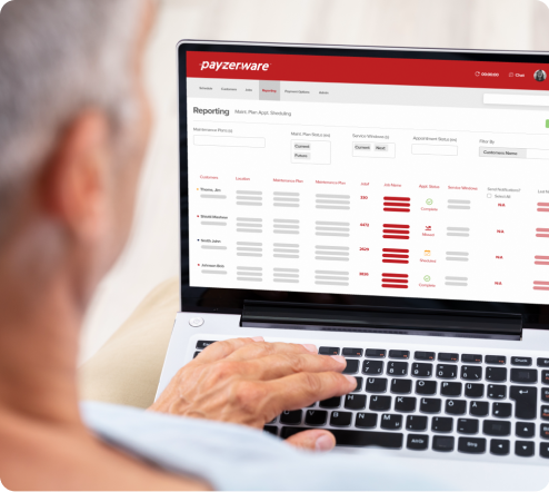 Man on laptop applying for Payzer financing from the Payzer website