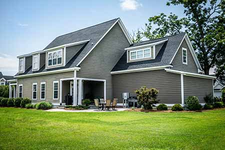 Front view of a mid-class, home with CertainTeed shingles on its roof
